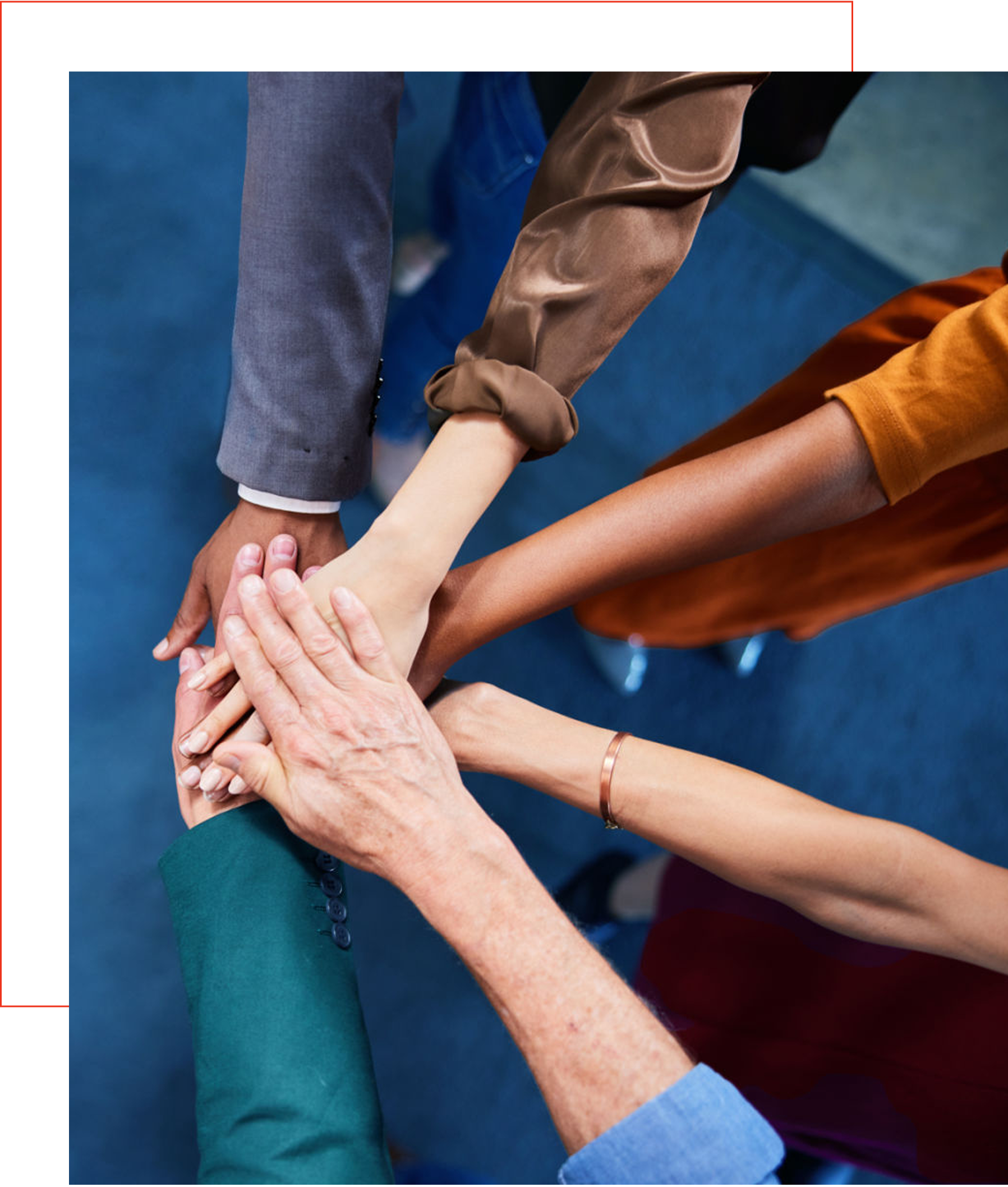 Hands joined in a teamwork gesture.
